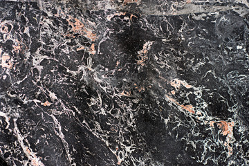 Background of black marble with interspersed