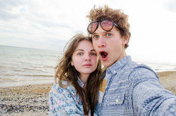 Couple selfie near sea, close-up photo, young lovers, stylish couple