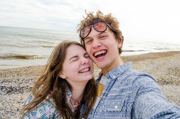Couple selfie near sea, close-up photo, young lovers, stylish couple