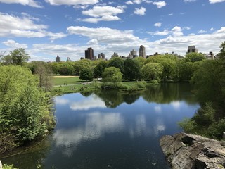 lake in Central Park on a sunny spring afternoon with clouds