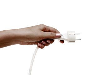 African female hand holds electric plug on a white background.