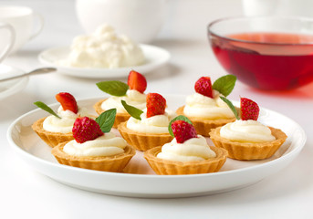 Many mini tarts with berries