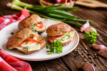 Fried patty filled with cheese, egg, bell pepper and scallion