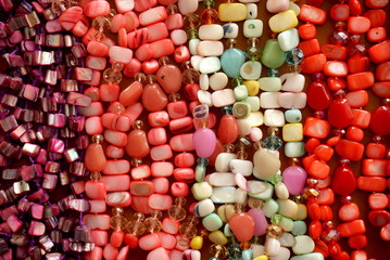 Colored Precious Stones Jewelery on a Wooden Background