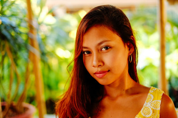 Natural portrait of young beautiful girl, with green background