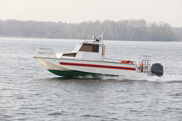 Fototapeta premium Moscow, Russia - April, 29: rescuer boat sails on Moscow river