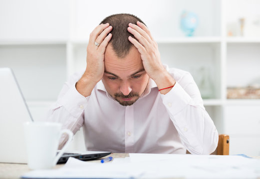 Disappointed worker feeling stressed