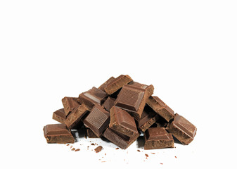 Pile of Dark Chocolate Chunks Isolated on White Background with Free Space for Design and Text  