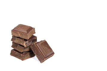 Closed up stack of Dark Chocolate Cubes Isolated on White Background with Free Space for Text  and Design 