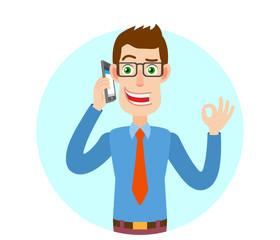 Businessman talking on mobile phone and showing a okay hand sign
