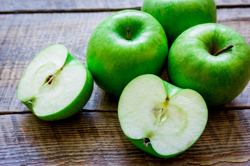 summer food with green apples on wooden background