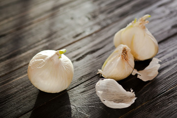 Onions on a dark wooden table