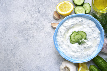 Tzatziki - yoghurt sauce with cucumber and dill.Top view with copy space.