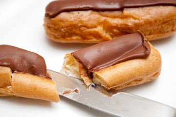 Fresh cream cakes being cut into slices