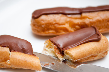 Fresh cream cakes being cut into slices