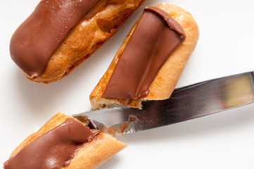 Fresh cream cakes being cut into slices