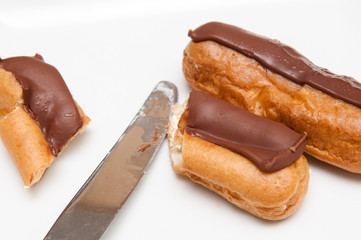 Fresh cream cakes being cut into slices
