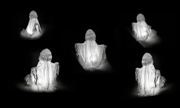 Many Halloween Ghosts on a Black Background. With Lighting Inside