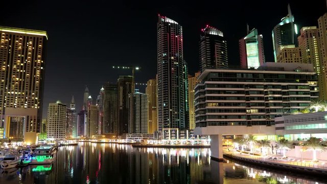 4K Dubai Marina night time lapse, United Arab Emirates. Dubai Marina - the largest man-made marina in the world. Dubai Marina is a canal city, carved along a 3 km stretch of Persian Gulf shoreline