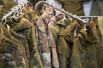 Samples camouflage military clothes in the store