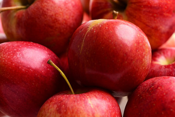 many red apples, fresh fruit background in market