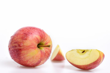red apple with water drops isolated on white