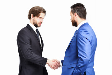 serious men in jacket hold hands each other in handshake
