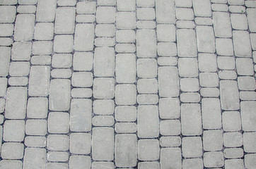 Background, texture of a city paving stone on the whole frame. Horizontal frame