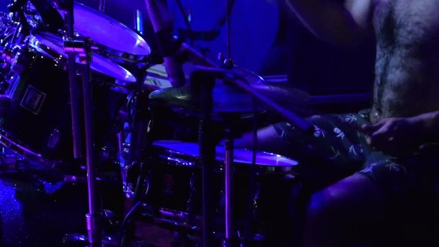 the drummer plays the drums fiercely