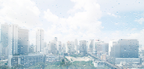 raindrops on window and city background
