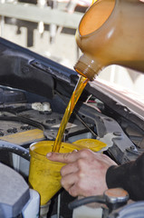 Filling Car Engine with Fresh Motor Oil