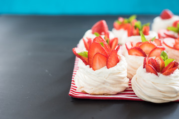 meringue nests with strawberry cream and fresh strawberries