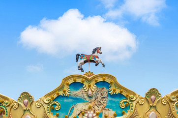 antique carousel horses tent in amusement park