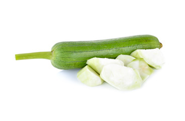whole and portion cut fresh luffa gourd with stem on white background