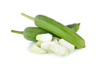 whole and portion cut fresh luffa gourd with stem on white background