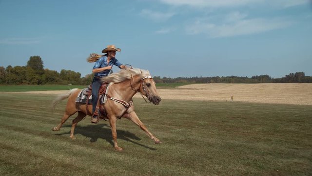 Woman horseback riding in slow motion