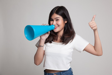 Beautiful young Asian woman show thumbs up announce with megaphone.