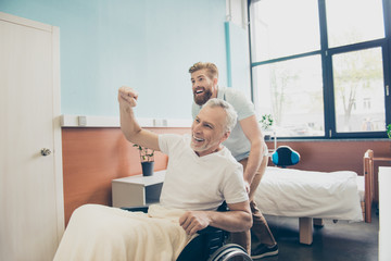 We did it! Cheerful family is celebrating good end of hard surgery that old patient had, they are...