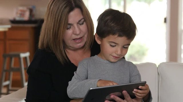 Mother and Son using digital tablet together