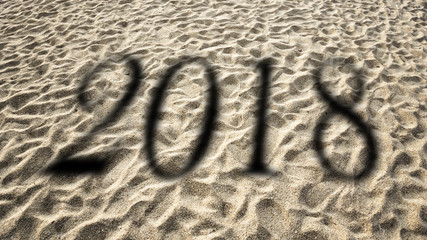 figures 2017 on the background of sand