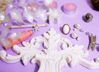 Jewelry table with lot of girl stuff on it, little mess in cosmetic brushes, women interior concept, perfume elegance things, little princess makeup