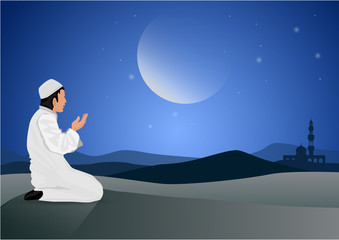 man praying  on moon background