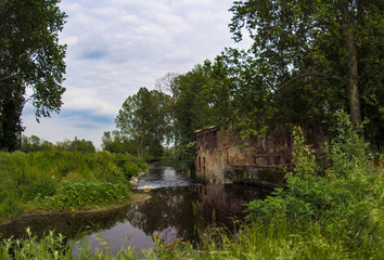 Fototapeta na wymiar On the course of the Olona river, since the Middle Ages, many mills were erected. At the beginning of the industrial era mills were exploited to drive machine tools.