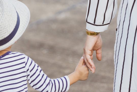 Mother Holding A Child's Hand