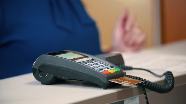 Pay by credit card - terminal in store, close up
