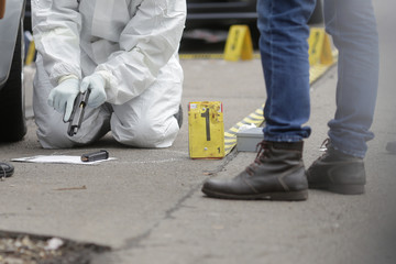 Crime scene/ Criminal investigators / BUCHAREST, ROMANIA - MAY 10: criminal investigators are...
