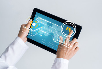 Close of female doctor hands working with tablet pc computer