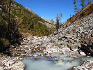 Neighborhood Belukha, hike to the magnificent Belukha. Kucherla river, stormy mountain river, sunny weather, around the mountain peaks.