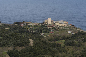 Distance view of a Monastery on The Holy Athos Mountain, Greece; seaside, spring time