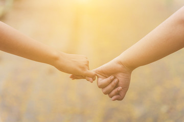 Closeup of loving couple holding hands